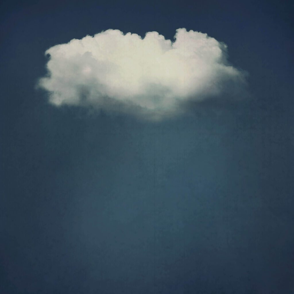 A cloud is shown in the sky with dark blue background.