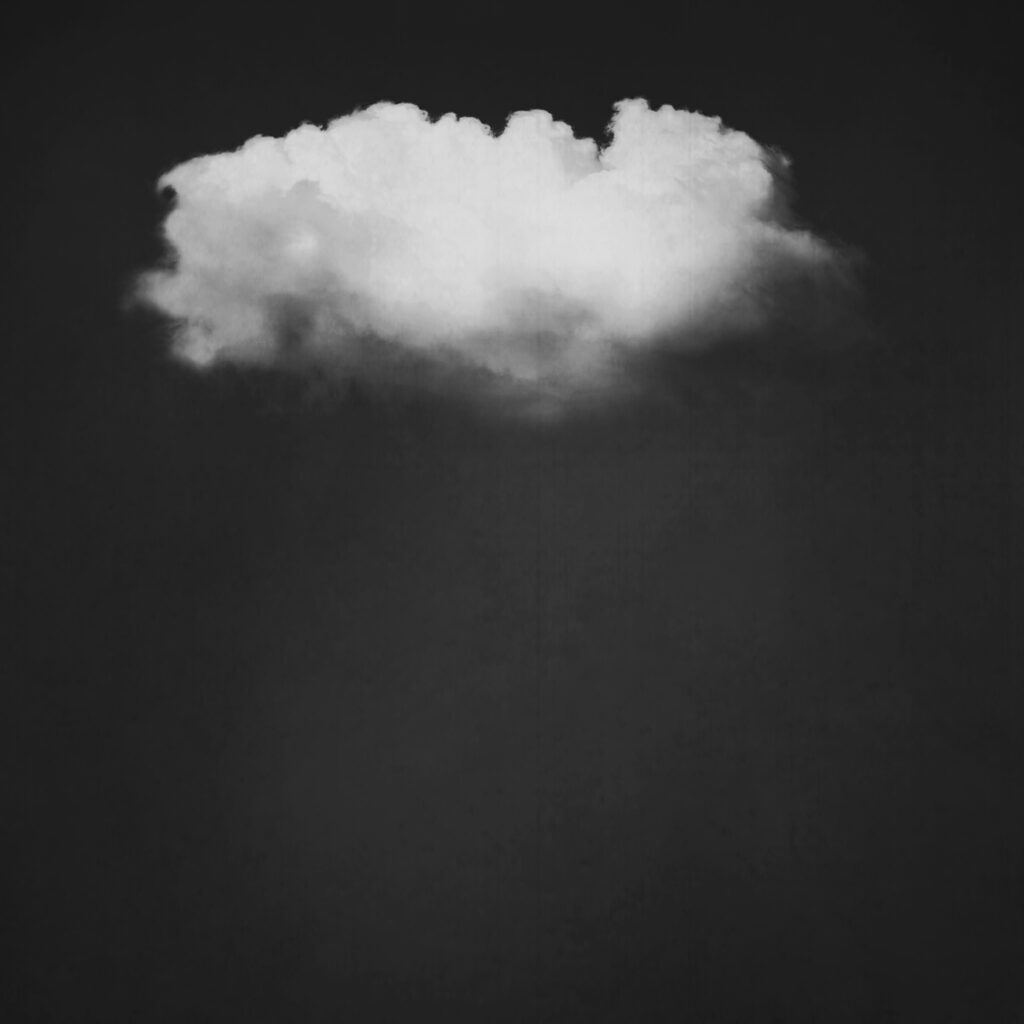 A cloud is shown in the sky with dark background.